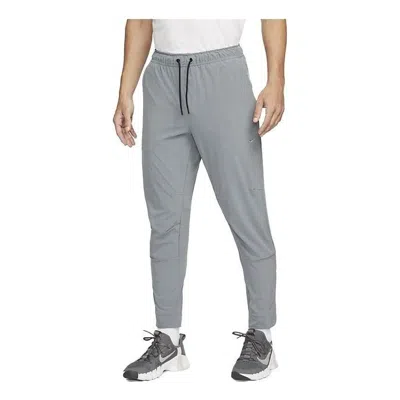 NIKE NIKE DRI-FIT ZIPPERED CUFF VERSATILE PANTS 'GREY'