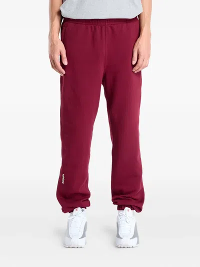 Nike Fleece Cuffed Sweatpants In Burgundy