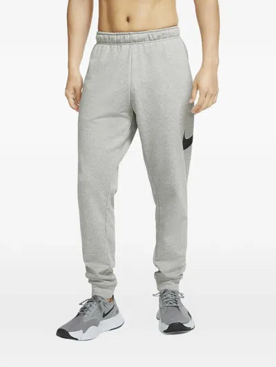 Nike Graphic Tapered Fitness Track Pants In Blue