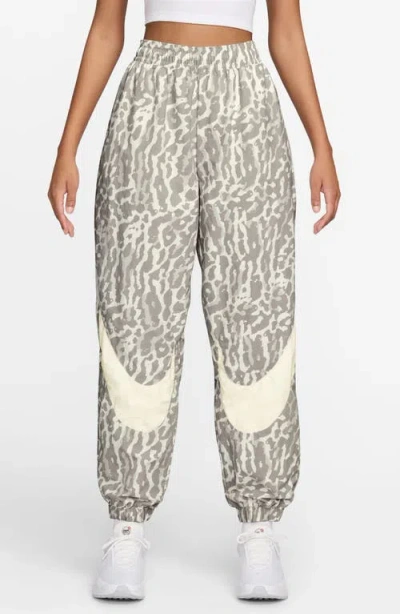 Nike Leopard Print Nylon Sweatpants In Multi