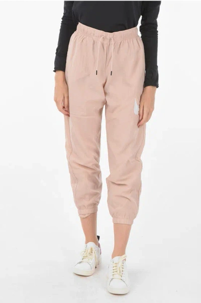 Nike Logo Printed Nylon Joggers In Pink