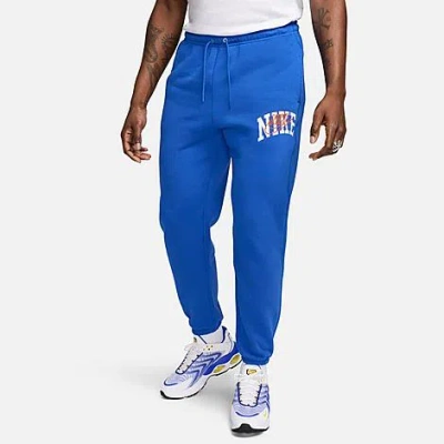 Nike Men's Club Fleece Arched Varsity Graphic Cuffed Sweatpants In Game Royal/safety Orange
