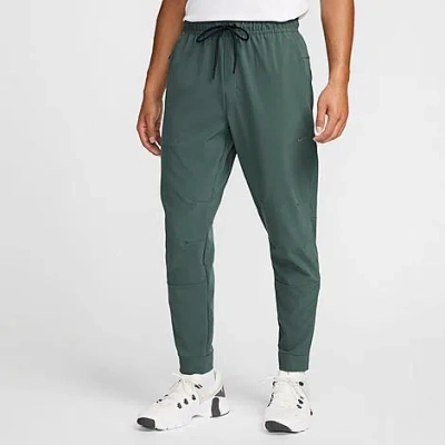 Nike Men's Dri-fit Unlimited Tapered Leg Versatile Training Pants In Vintage Green/black/vintage Green