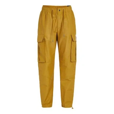 Nike Men's Jordan Flight Woven Pocket Sports Pants/trousers/joggers Yellow In Gold