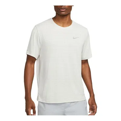 Nike Men's  Dri-fit Miler Solid Color Logo Luminous Crew Neck Running Short Sleeve Light Bone T-shirt In White