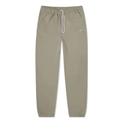 Nike Men's  Logo Embroidered Bundle Feet Casual Solid Color Sports Pants/trousers/joggers Gray In Brown