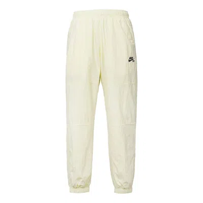 Nike Men's  Logo Pattern Loose Bundle Feet Sports Pants/trousers/joggers Beige In Neutral