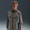 Nike Tech Logo-print Panelled Stretch-nylon Hooded Jacket In Green