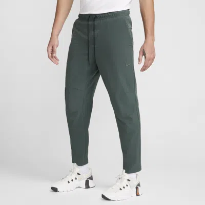 Nike Men's Unlimited Dri-fit Tapered Leg Versatile Pants In Green