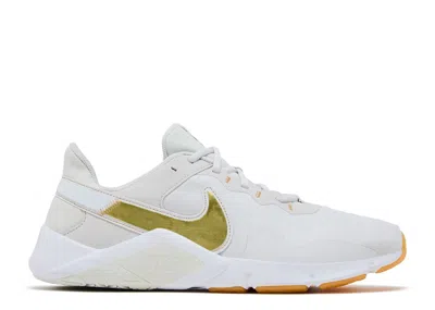 Nike Wmns Legend Essential 2 'platinum Tint Metallic Gold Star' In White