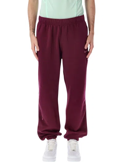 Nike Nocta Cs Fleece Sweatpants With Reflective Zip Pockets In Burgundy