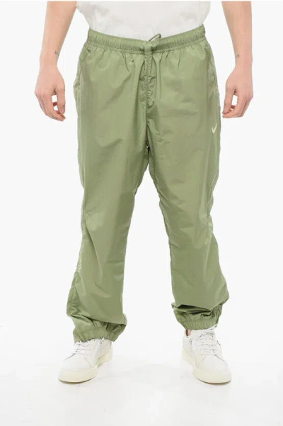 Nike Nocta Technical Nylon Trousers With Ankle Zip And Drawstring Wa