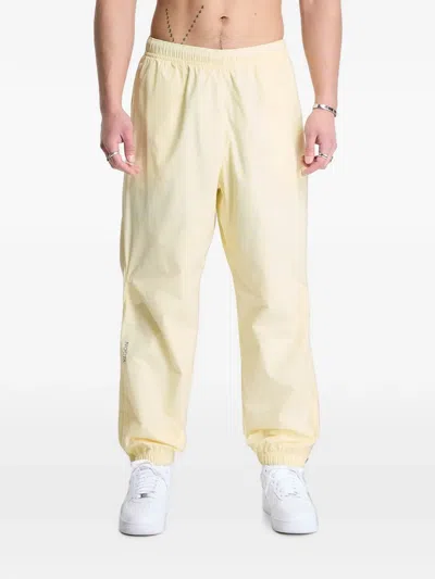 Nike Northstar Nocta Track Pants In Yellow