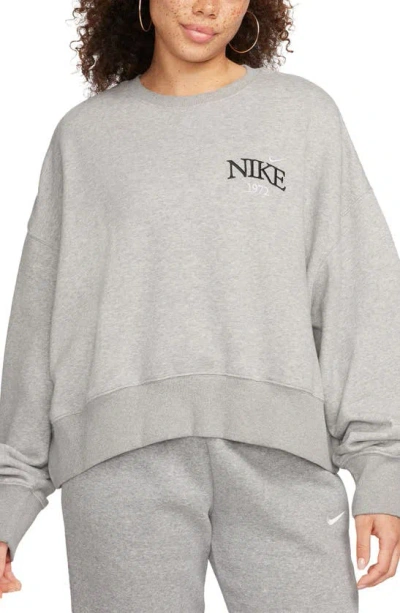 Nike Phoenix Fleece Varsity Oversize Crewneck Sweatshirt In Dark Grey Heather