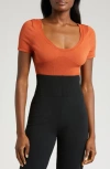 Nike Short Sleeve Rib Sweater Bodysuit In Orange