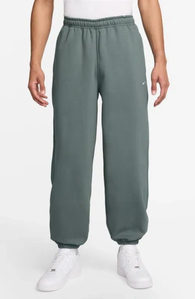 NIKE NIKE SOLO SWOOSH FLEECE SWEATPANTS