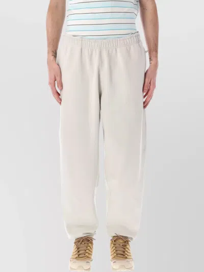 Nike Solo Swoosh Jogging Trousers With Zip Pockets In Light Bone
