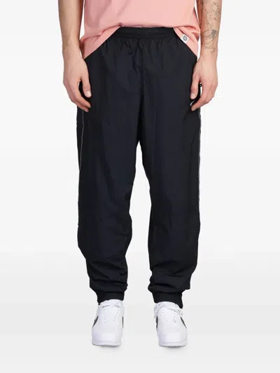 NIKE SOLO SWOOSH TRACK PANTS