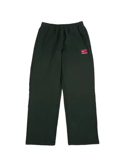 Nike Solo Swoosh Track Pants In Green