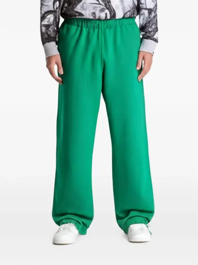 Nike Solo Swoosh Track Pants In Green