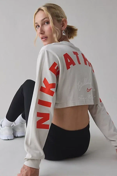 Nike Sportswear Graphic Oversized Long Sleeve Cropped Tee In Light Bone, Women's At Urban Outfitters In Sand