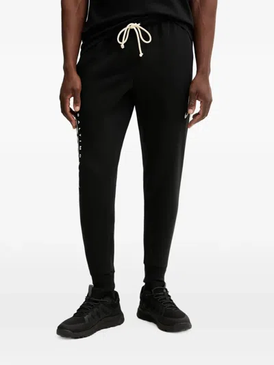Nike Standard Issue Track Pants In Black