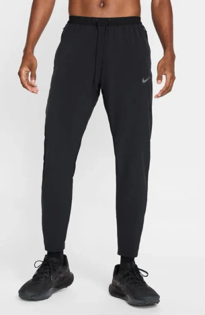 Nike Stride Dri-fit Woven Running Pants In Black