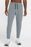Nike Stride Dri-fit Woven Running Pants In Gray