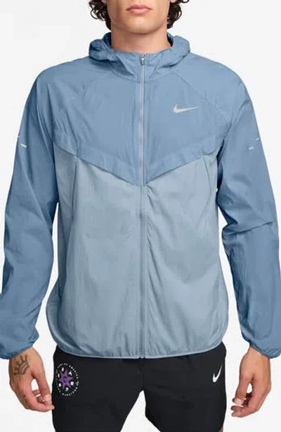Nike Stride Dri-fit Uv Hooded Running Jacket In 486 Workbl/refsil