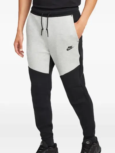 Nike Slim-fit Tapered Logo-print Cotton-blend Tech Fleece Sweatpants In Black
