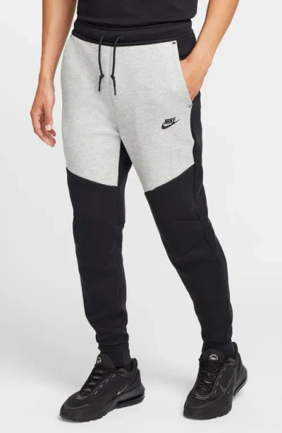 Nike Slim-fit Tapered Logo-print Cotton-blend Tech Fleece Sweatpants In Black