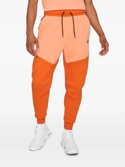 Nike Tech Fleece Joggers In Orange