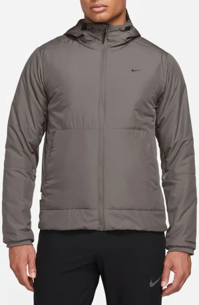 Nike Therma-fit Unlimited Training Jacket In Brown
