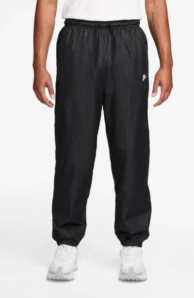 Nike Windrunner Water Repellent Track Pants In Black