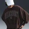 Nike Women's Court Heritage Over-oversized Crew-neck Graphic Tennis Sweatshirt In Brown
