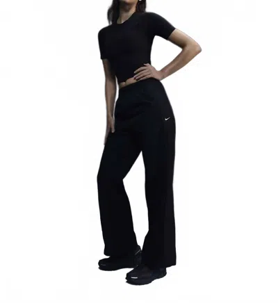 NIKE WOMEN'S HIGH WAISTED WOVEN OPEN HEM PANTS IN BLACK