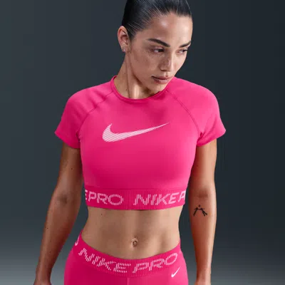 Nike Women's  Pro Dri-fit Short-sleeve Cropped Graphic Top In Pink