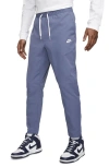Nike Woven Tapered Leg Pants In Diffused Blue/white