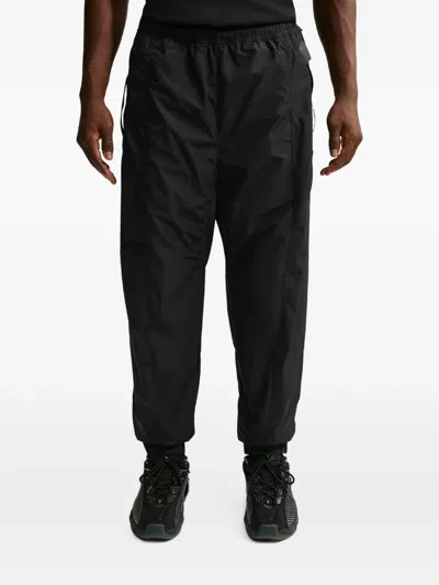 Nike Zombie-cut Track Pants In Black