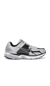 Nike Vomero 5 Sneaker In Phantom/mtlc Platinum-lt Iron Ore-baroque Brown-bl