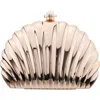 Nina Mariam Shell Clutch In Gold