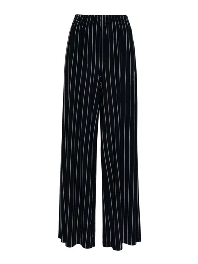 NORMA KAMALI PINSTRIPE FLARED TROUSERS