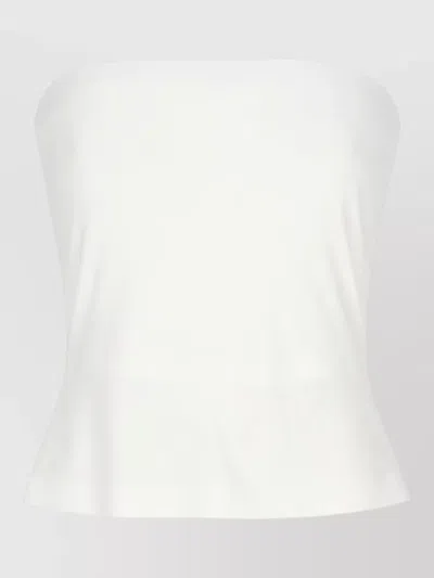 Norma Kamali Sleeveless Fitted Top Featuring Peplum Hem In White