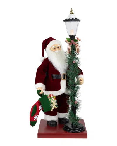 Northlight Animated & Musical Santa Claus Figure With Lighted Lamppost &  Christmas Stocking In Multi