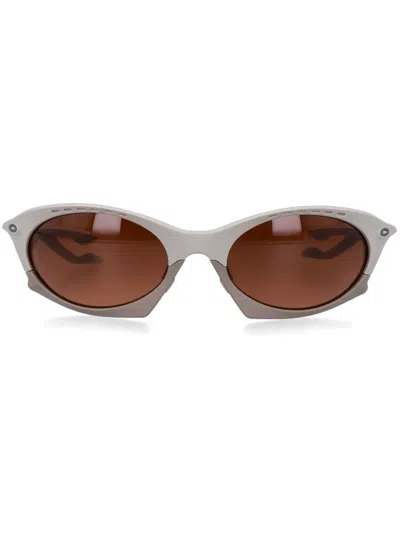 Oakley Bold Cat-eye Sunglasses With Performance Features In Neutral