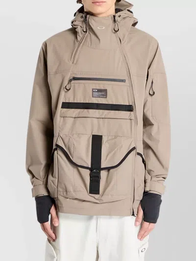 Oakley Versatile Hooded Jacket Adjustable Features In Brown