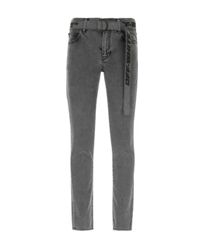 OFF-WHITE OFF-WHITE LOGO DETAILED BELTED SKINNY JEANS