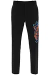 OFF-WHITE OFF-WHITE SLIM PANTS WITH GRAFFITI PATCH MEN