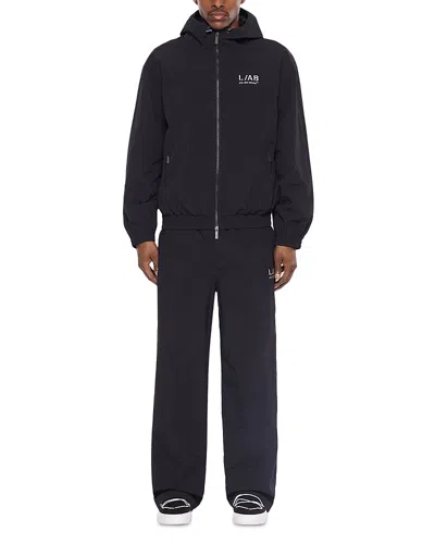 Off-white Relaxed Fit Reflective Diagonal Graphic Logo Track Pants In Black