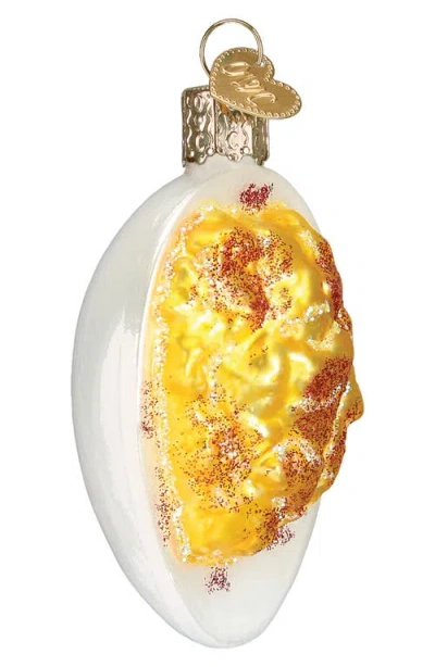 Old World Christmas Deviled Egg Glass Ornament In White/yellow